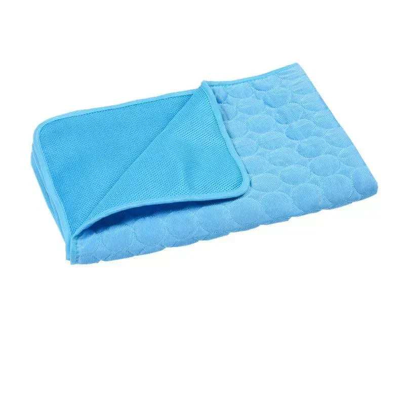Blue cooling dog mat with mesh and terry cloth layers for pet comfort
