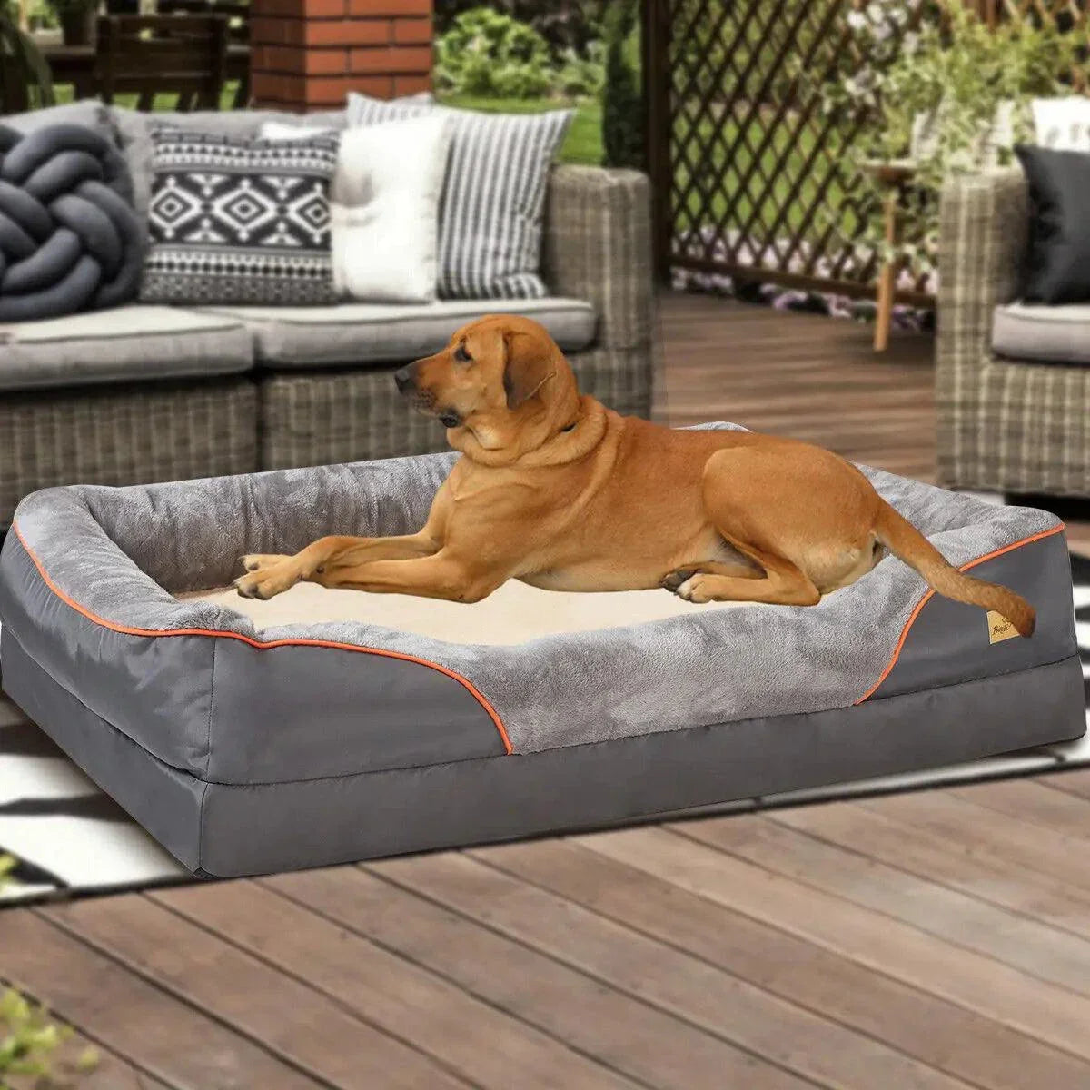 Orthopedic foam dog bed with cotton-padded bolster and removable cover in gray, featuring waterproof fabric and solid pattern.