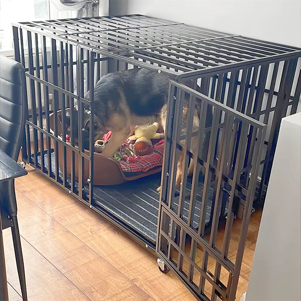 XXL large heavy duty iron dog crate with lockable wheels and removable tray containing a large dog indoors